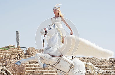 CAESAREA - MARCH 4: Purim celebrations parade, girl on a horse in Ceasearea, Israel on March 4, 2015 Editorial Stock Photo