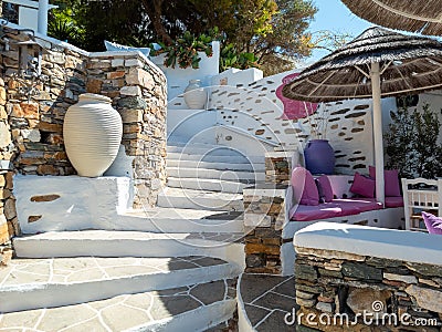 Cafe bar restaurant at Kastro Syfnos island Cyclades Greece. Greek architecture archaic amphorae Stock Photo