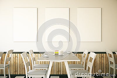 Cafe interior with three posters Stock Photo