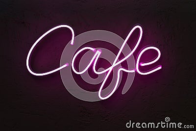 Cafe sign made from neon alphabet on a black background. Stock Photo