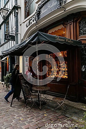 Cafe on the streets of the old town of Rouen with traditional half-timbered heritage houses. Rouen, Normandy, France Editorial Stock Photo