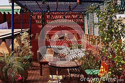 Cafe table and chairs with decorations and green plants Stock Photo