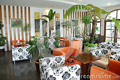 Cafeteria with green tropical indoor plant Stock Photo