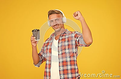 Caffeine gives him energy. Happy man make power gesture holding coffee cup. Caffeine addicted. Natural stimulant Stock Photo