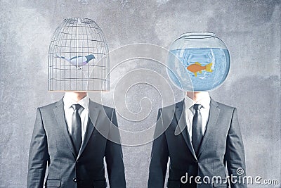 Cage and fishbowl heads Stock Photo