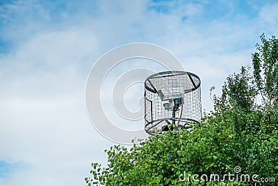 A caged security camera hidden Stock Photo