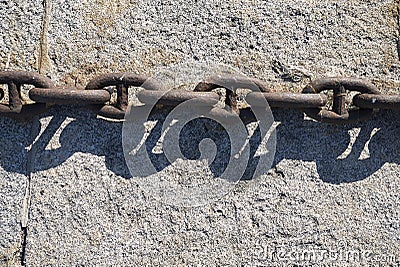 Metal chain on a wall Stock Photo