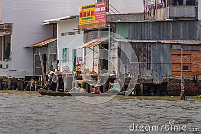 Returning from floating wholesale market on Kinh 28 canal in Cai Be, Mekong Delta, Vietnam Editorial Stock Photo