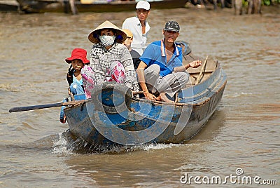 People cross Mekong river by motorboat in Cai Be, Vietnam Editorial Stock Photo