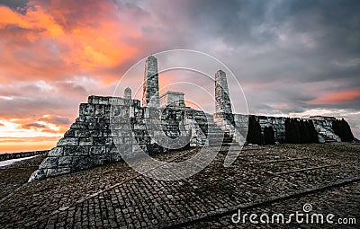 Cairn of General Milan Rastislav Stefanik on sunset and cloudy sky in Brezova pod Bradlom town. Old historic landmark UNESCO. Stock Photo