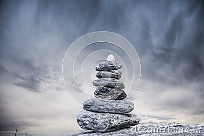 Cairn and Stormy Sky Stock Photo