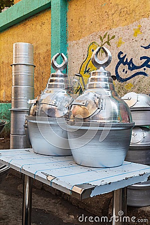 Metal drink urns for sale at an outdoor market Editorial Stock Photo