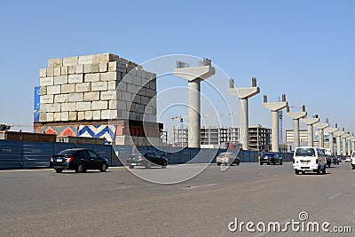 A construction site of Cairo monorail over head railway transportation system with a raw of circular steel and concrete columns Editorial Stock Photo