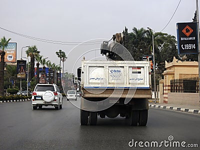 Cairo, Egypt, April 8 2023: Maintenance lift truck with a lifting mechanical equipped crane with a cable for lifting heavy objects Editorial Stock Photo