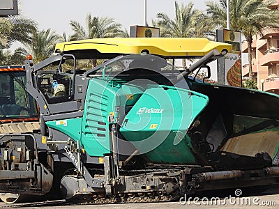 Track asphalt paver truck, A paver (road paver finisher, asphalt finisher, road paving machine) is a Editorial Stock Photo