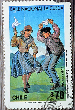 Old used postage stamp printed in Chile features the national Chilean dance of The Cueca Editorial Stock Photo