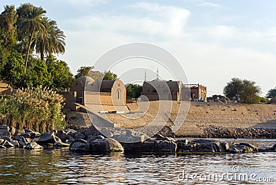 Typical white houses of a Nubian village surrounded by palm trees near Cairo Egypt and on the banks Editorial Stock Photo