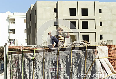 Illegal use of cargo transport to transport people. The child moves around the city in the back of a truck with bricks. Editorial Stock Photo