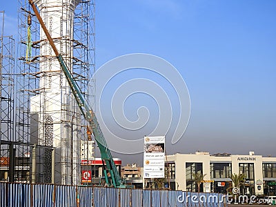 Cairo, Egypt, January 20 2024: A construction site of a new mosque with a steel structure of the dome and scaffolds all along the Editorial Stock Photo