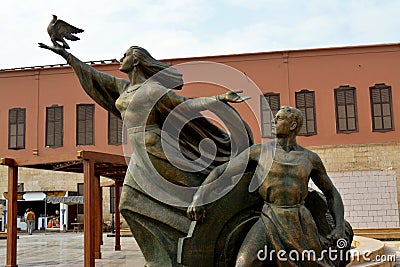 Cairo, Egypt, January 7 2023: old Egyptian statue of a lady flying a pigeon and a man from the Egyptian national military museum Editorial Stock Photo