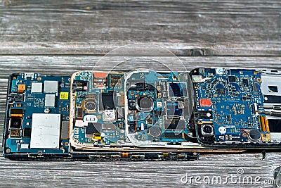 Cairo, Egypt, November 9 2022: Smartphone cellular mobile devices from inside with motherboard electronic chip, camera and SIM Editorial Stock Photo