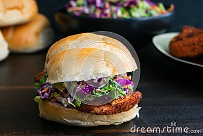 Cajun Chicken Sandwich on a Dark Wood Background Stock Photo