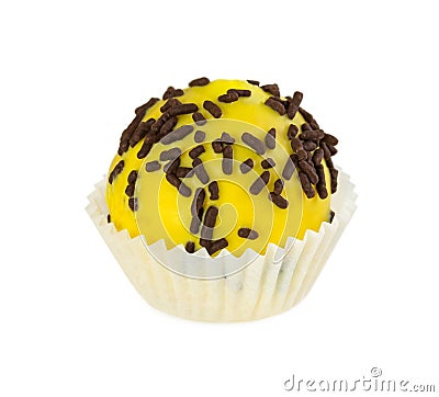 Cake ball with yellow glaze and chocolate sprinkles Stock Photo