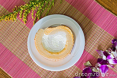 cake cream roll on pink bamboo curtain Stock Photo