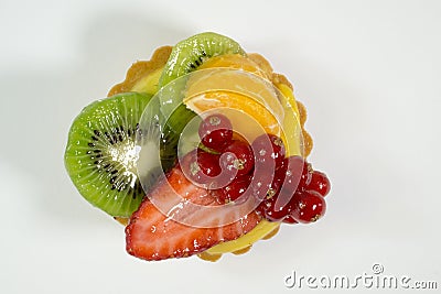 Cake with fresh bio fruit, orange, kiwi, red currant, strawberry, photo view from the top, white background, isolate Stock Photo