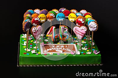 Cake with mastic on prom night on black background. The names of Stock Photo
