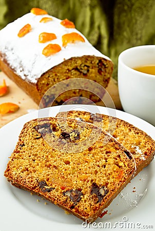 Cake with orange candied peel, chocolate drops and citrus drink Stock Photo