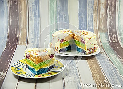 The cake, Rainbow Cake. Rainbow cake layers. Slice of Birthday Cake Stock Photo