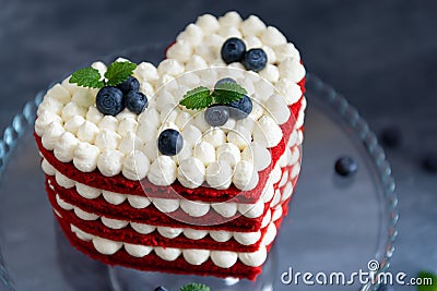 Cake Red Velvet in heart shape for St. Valentine`s Day. Sweet Valentine. Bakery, confectionery concept Stock Photo