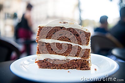Cake slice on white plate in paris, france, dessert. Cake with cream, food. Temptation, appetite concept. Dessert, food, snack, pa Stock Photo