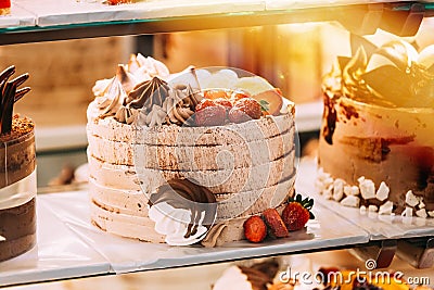 cake with strawberries, yummy assortment baked pastry in bakery. Various Different Types Of Sweet Cakes In Pastry Shop Stock Photo