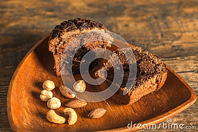 Cake on wooden bowl. Stock Photo