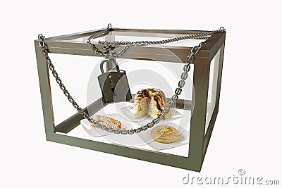 Cakes in close metal box with chains diet concept composition photo Stock Photo