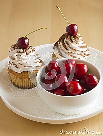 Cakes and sweet cherry Stock Photo