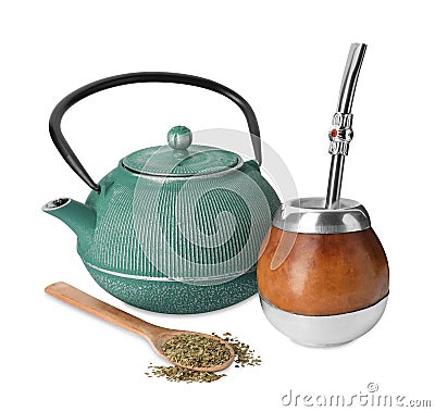 Calabash, bombilla, teapot and spoon with mate tea on white background Stock Photo