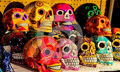 Calacas, wooden skull Day of the Dead masks on market in Cabo San Lucas, Mexico Editorial Stock Photo