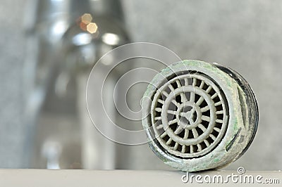 Calcified faucet sieve Stock Photo