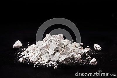 Calcium Chloride flakes, salt in solid state, used in brine for refrigeration machines, road dust and ice control, in cheese and Stock Photo