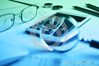Calculator button plus and magnifying glass on graph paper background, Success business concept Stock Photo