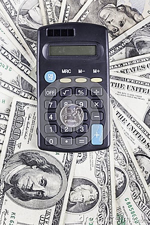 Calculator and coin ruble on the background of banknotes dollars Stock Photo