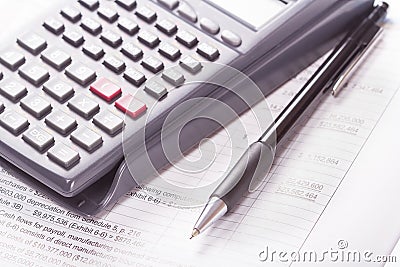 Calculator, financial statement, pen Stock Photo