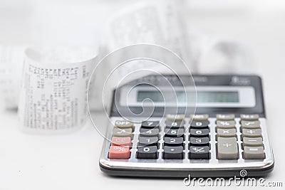 Calculator with many receipts for calculating family budgets Stock Photo