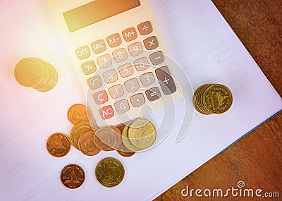 Calculator money finance object business accounting concept counting coins money calculator on white notes paper Stock Photo