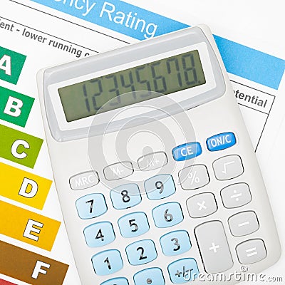 Calculator over energy efficiency chart - close up Stock Photo