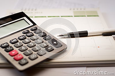 Calculator and pen and calendar Stock Photo