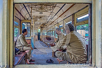 Calcutta Tramways Company (CTC) running staff resting inside tram Kolkata Editorial Stock Photo